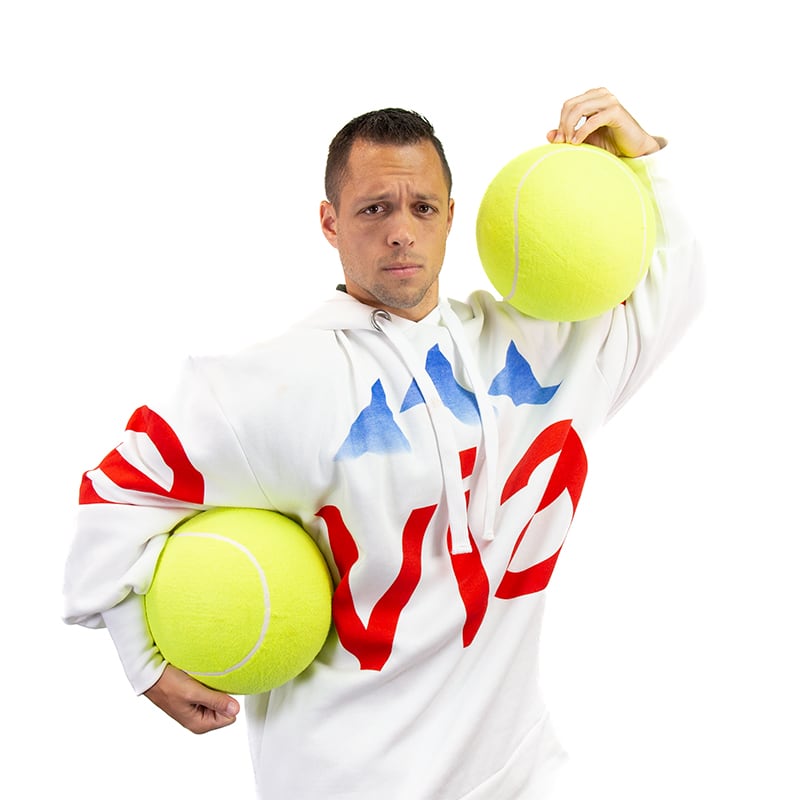 evian man holding oversize tennis balls
