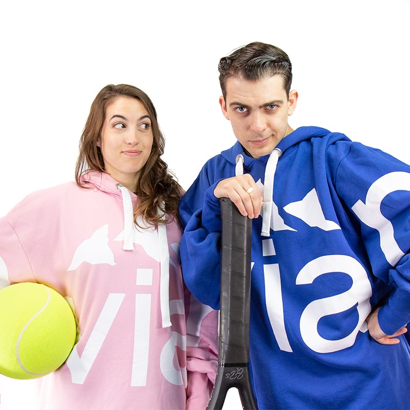evian couple holding giant tennis balls