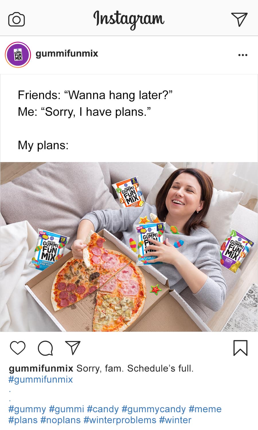 woman laughing with a pile of gummis and pizza