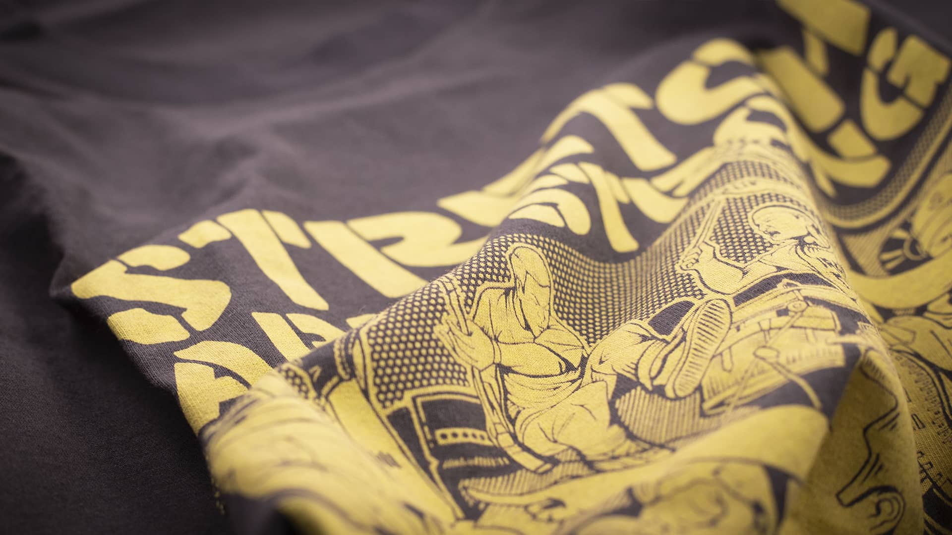 close up detail of stretch arm strong t shirt design