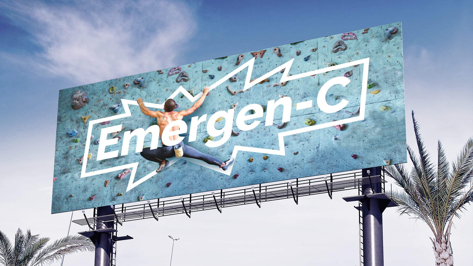 Emergen-C Pitch billboard concept of a man climbing a wall through the Emergen-C logo