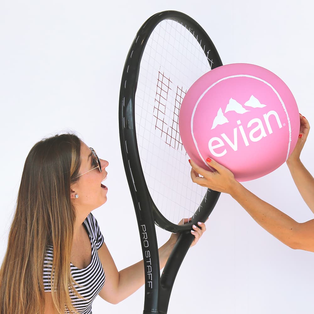 oversized tennis racquet and tennis ball